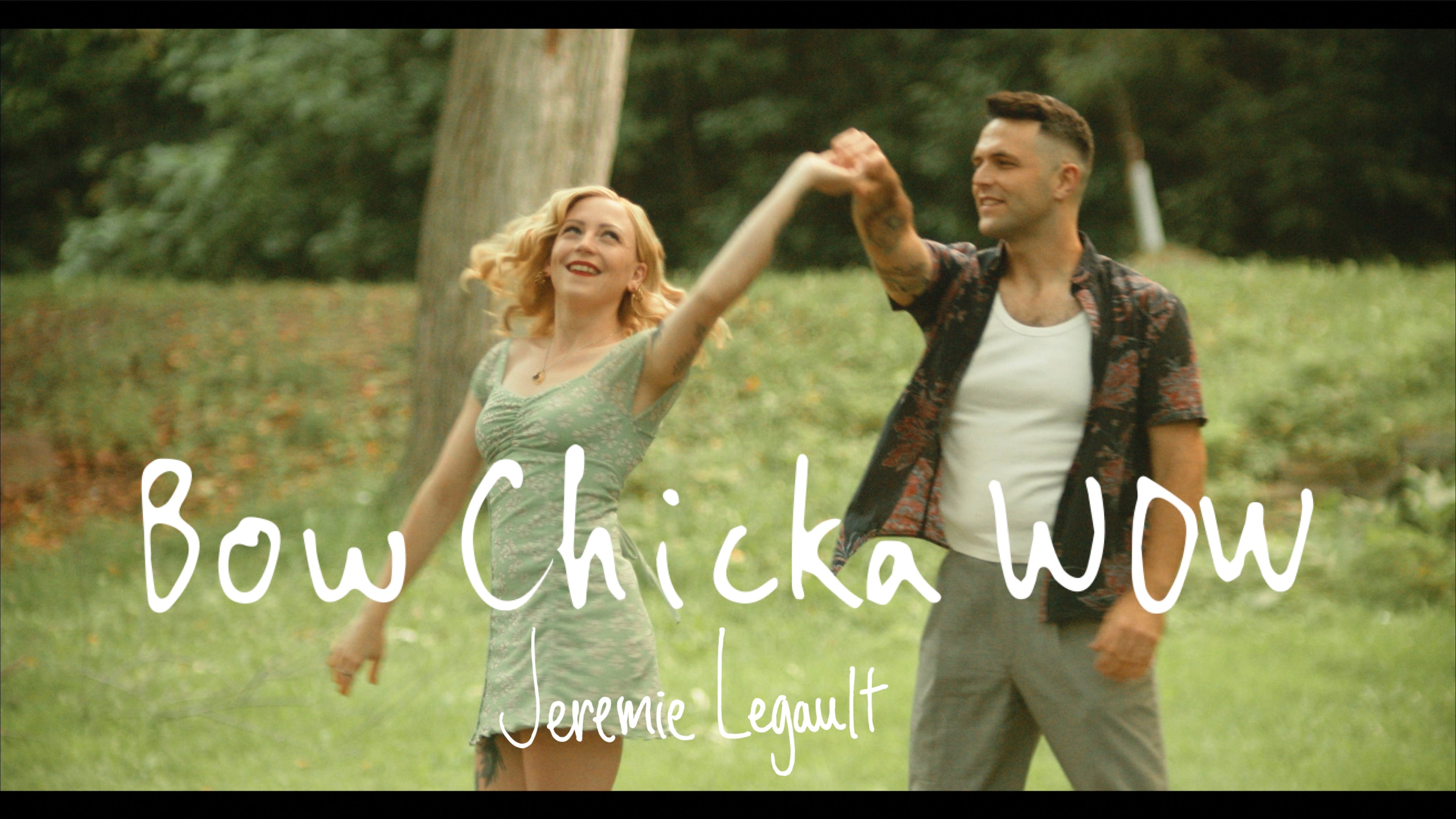 Load video: Video thumbnail for &#39;Bow Chicka WOW&#39; music video: An energetic and vibrant scene capturing the essence of Jeremie Legault&#39;s anthemic pop rock song. The video showcases dynamic performances and uplifting visuals, reflecting the spirited nature of the music. Featuring vibrant colors and captivating scenes that evoke feelings of joy and empowerment.